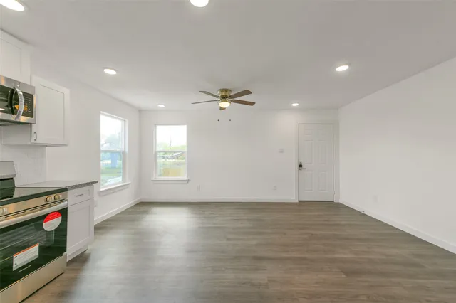a view of an empty room and a window