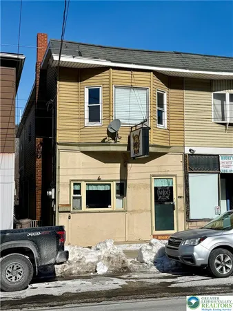 a car parked in front of a house