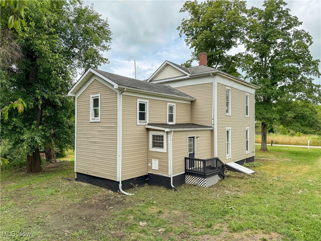 6118 Institute Road Rome, OH 44085 - Photo 20 of 27 Back of property featuring a lawn and a chimney