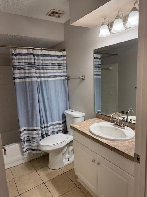 6014 Indrio Road, Unit F2 Fort Pierce, FL 34951 - Photo 12 of 27 a bathroom with a sink a toilet and a mirror