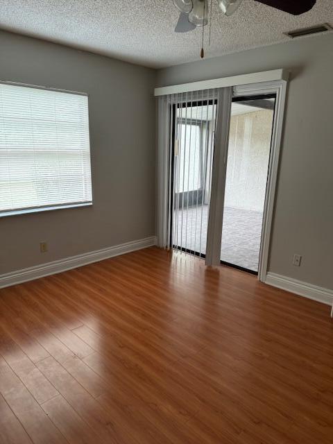 6014 Indrio Road, Unit F2 Fort Pierce, FL 34951 - Photo 13 of 27 a view of a room with wooden floor and balcony