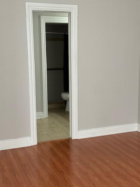6014 Indrio Road, Unit F2 Fort Pierce, FL 34951 - Photo 15 of 27 a view of a room with wooden floor and a bathroom