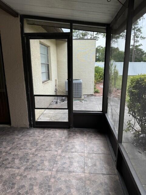6014 Indrio Road, Unit F2 Fort Pierce, FL 34951 - Photo 21 of 27 a view of a porch with wooden floor and a gate