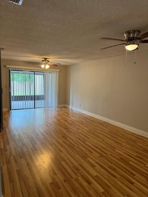 6014 Indrio Road, Unit F2 Fort Pierce, FL 34951 - Photo 7 of 27 a view of empty room with wooden floor