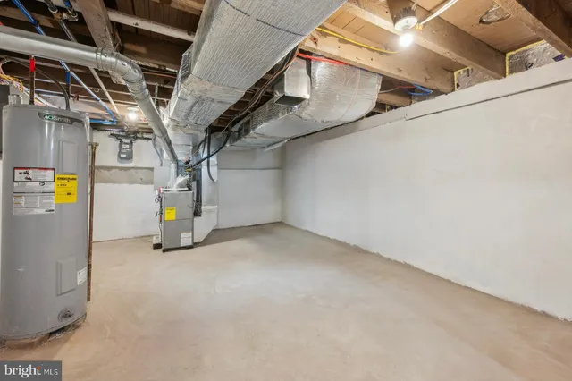 a view of storage and utility room with stairs