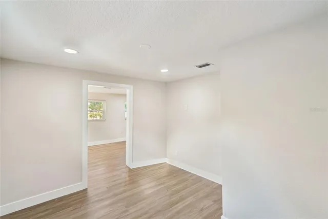 a bathroom with a shower a sink and a mirror