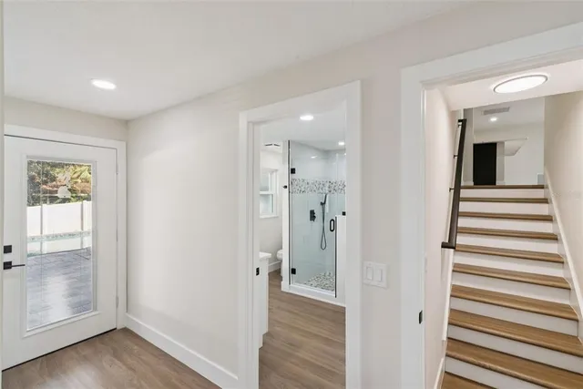 a view of a ceiling fan with wooden floor