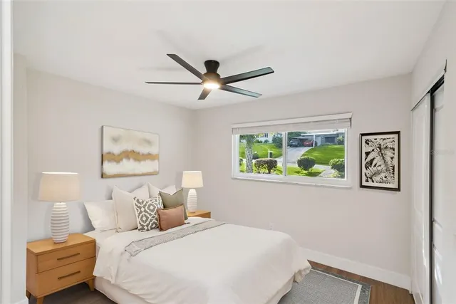 a bathroom with a sink and mirror with bathtub