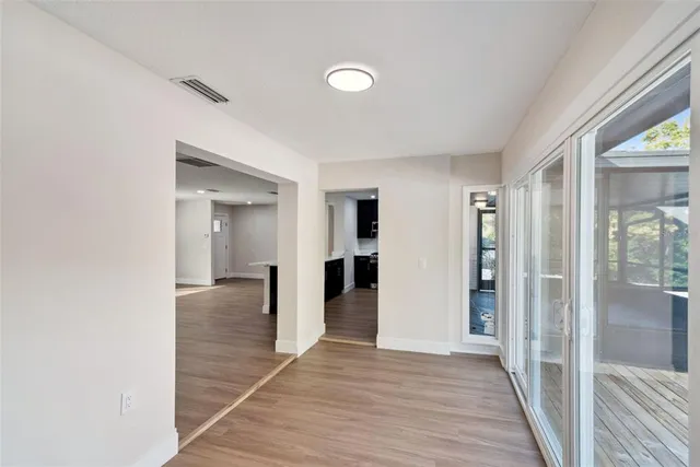 a view of patio with couches a fire pit and potted plants