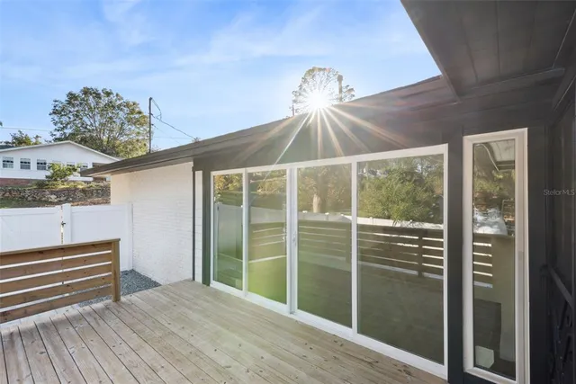 an aerial view of a house with garden space and street view
