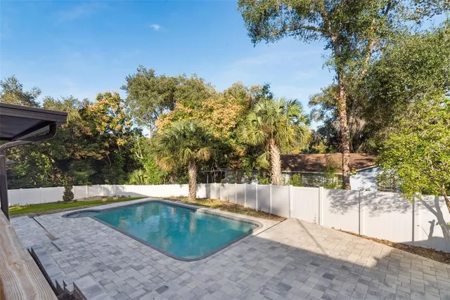 an aerial view of a house with a yard and a garden
