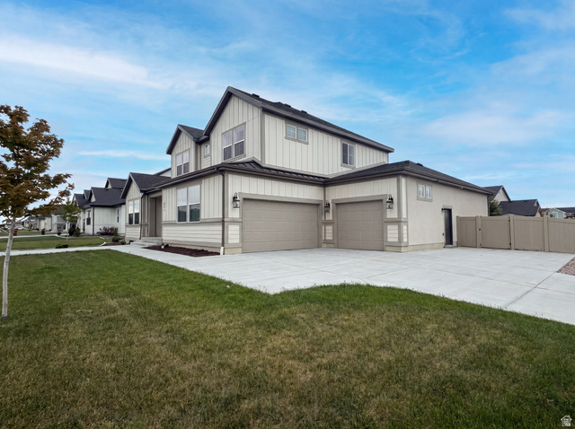 1251 North 2525 West Clinton, UT 84015 - Photo 27 of 30 Contemporary two-story residence featuring light-toned siding and dark trim