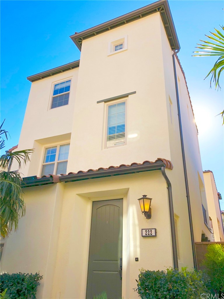 a view of a house with pool and sitting area