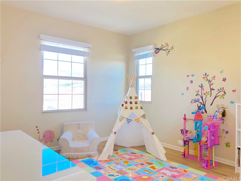 222 Firefly Irvine, CA 92618 - Photo 16 of 26 a bedroom with baby toys and a large window