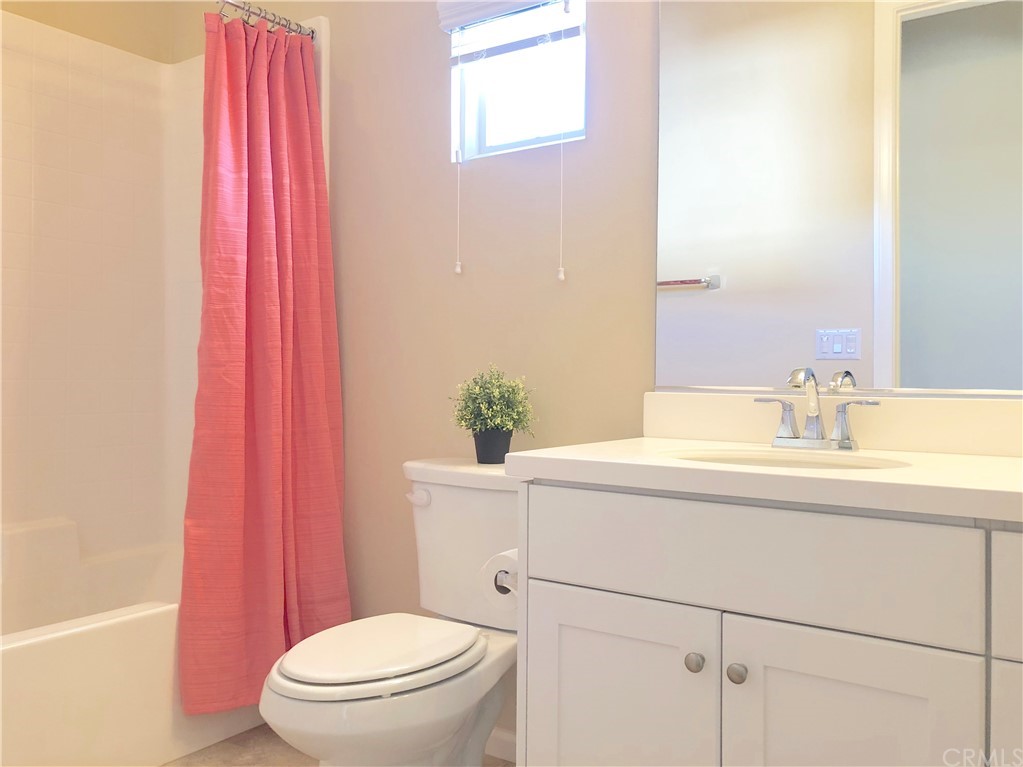222 Firefly Irvine, CA 92618 - Photo 17 of 26 a bathroom with a sink a toilet and shower curtain