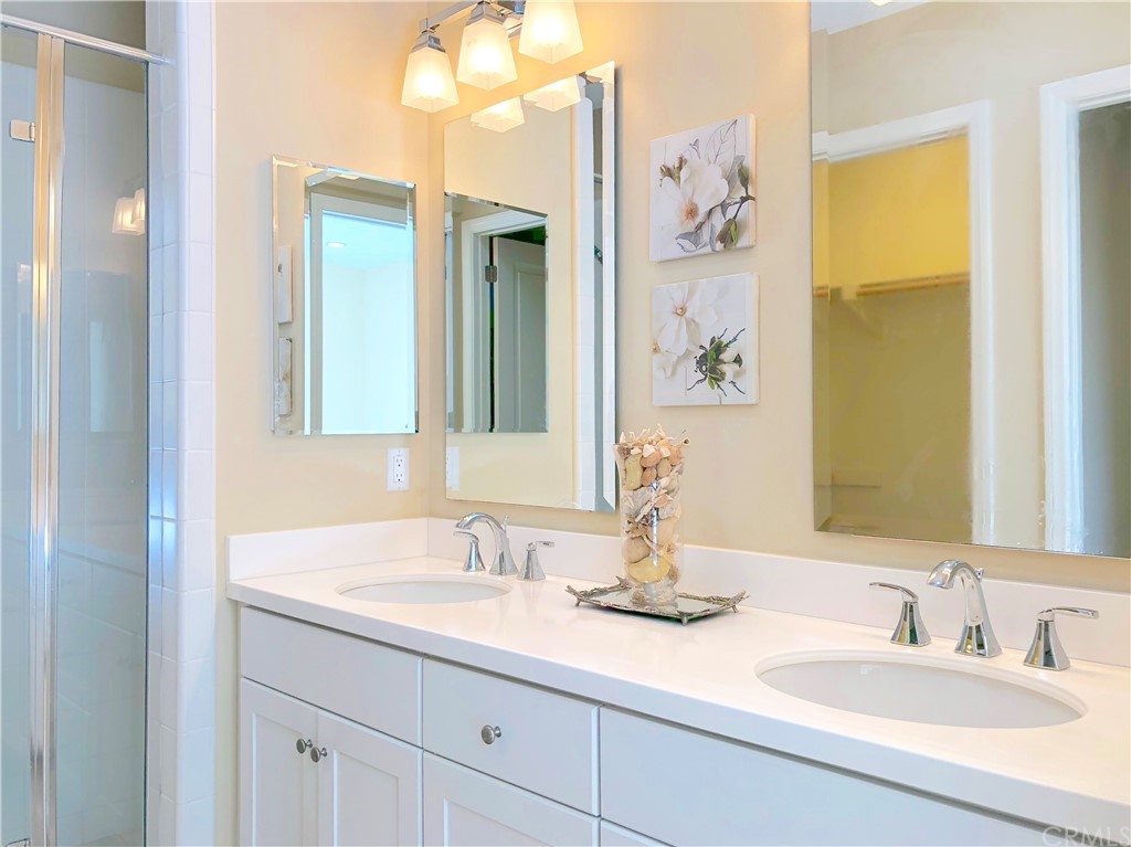 222 Firefly Irvine, CA 92618 - Photo 19 of 26 a bathroom with a sink and a mirror