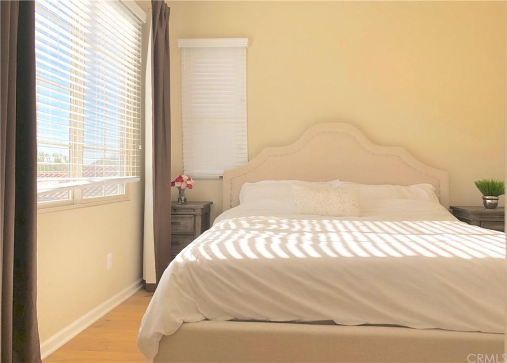 222 Firefly Irvine, CA 92618 - Photo 23 of 26 a bedroom with a bed and a window