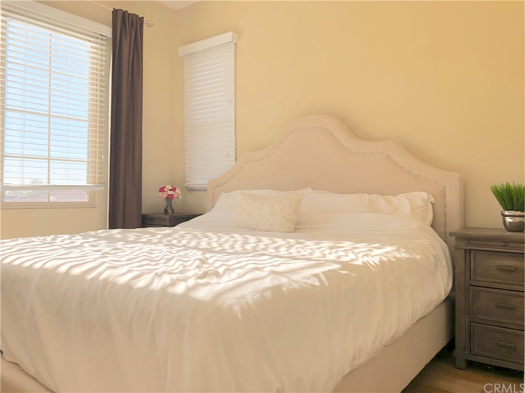 222 Firefly Irvine, CA 92618 - Photo 24 of 26 a large bed sitting in a bedroom next to a window