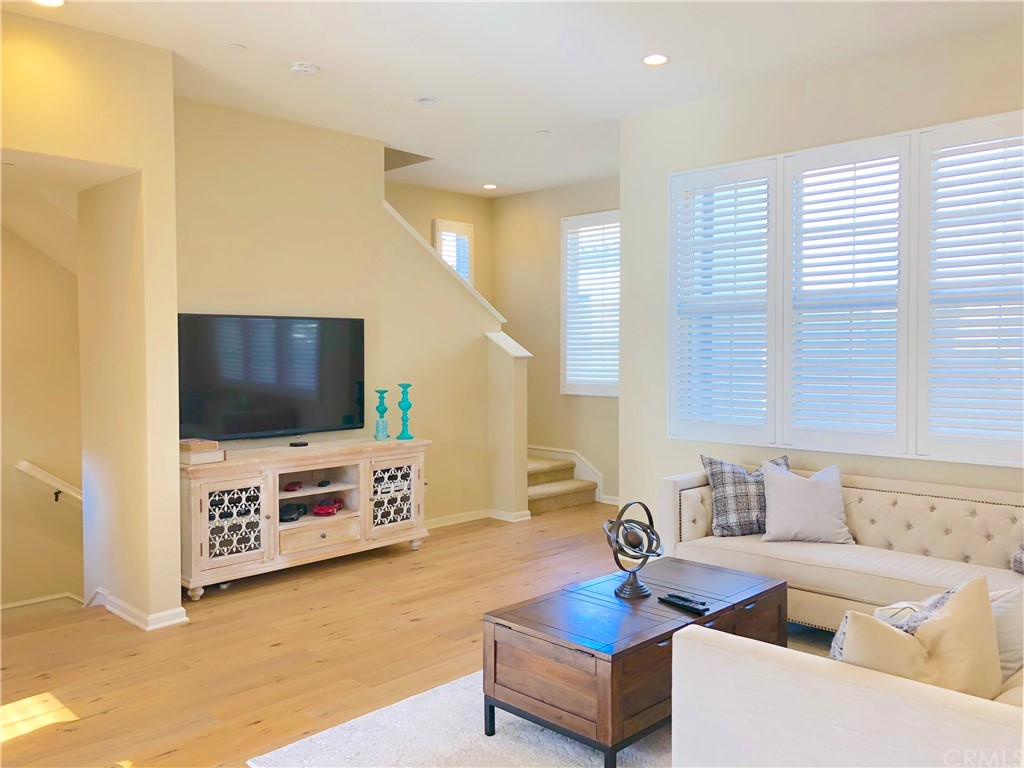 222 Firefly Irvine, CA 92618 - Photo 7 of 26 a living room with furniture and a flat screen tv