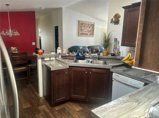 a kitchen with a sink counter top space and stove top oven