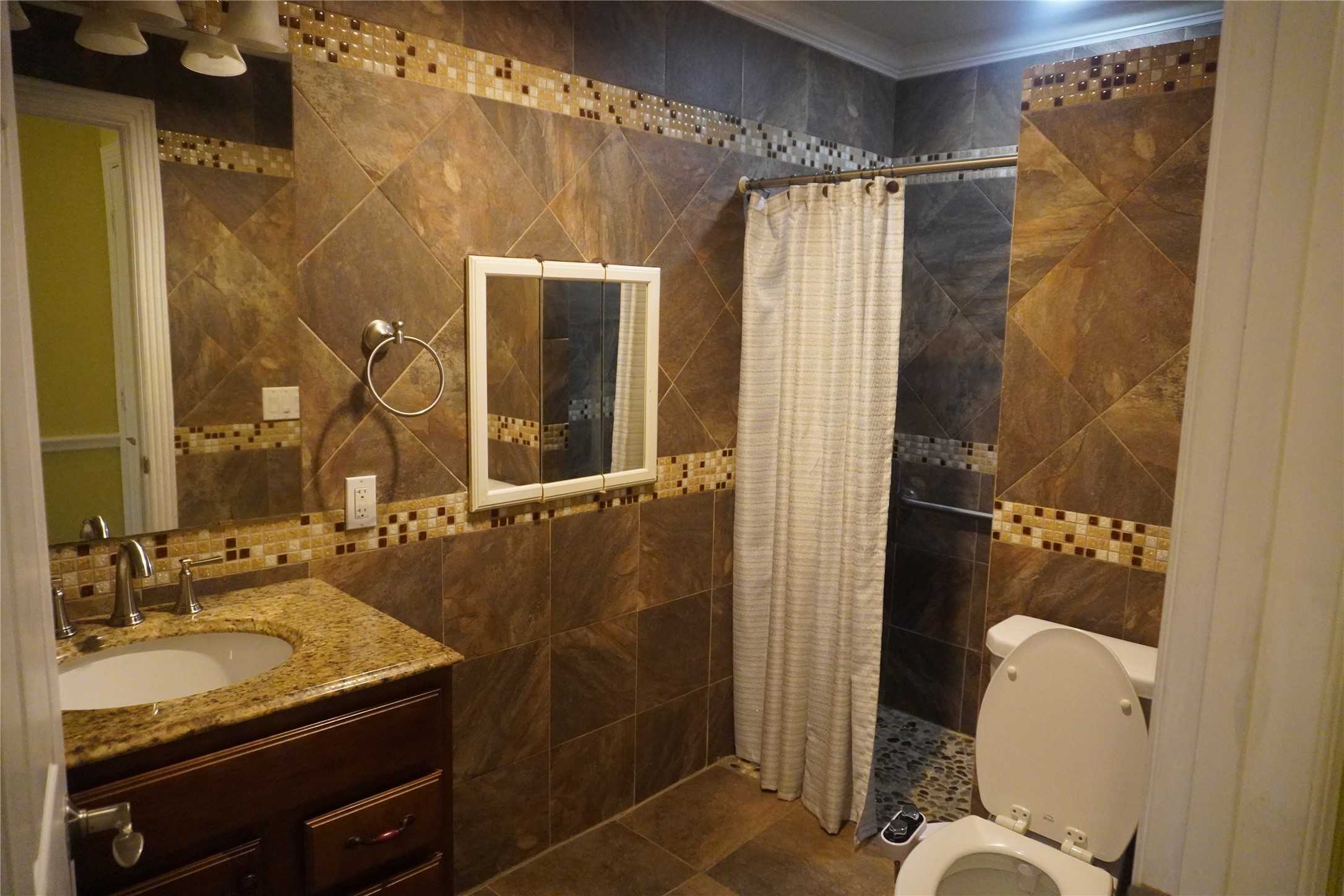 7506 Dearborn Street Houston, TX 77055 - Photo 9 of 15 a bathroom with a sink toilet and shower
