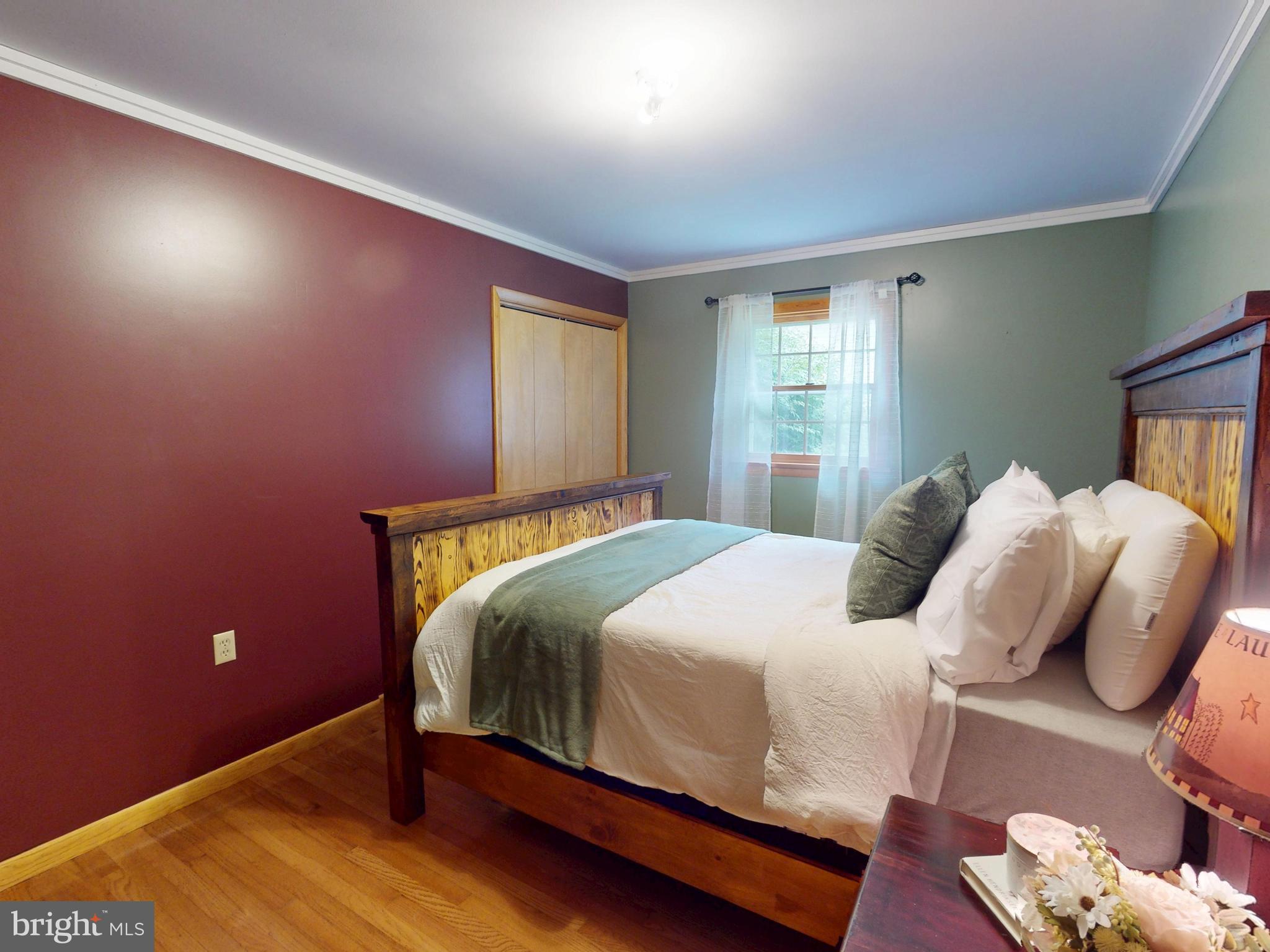 129 Walker Drive Spring Mills, PA 16875 - Photo 15 of 29 a bedroom with a bed and a window