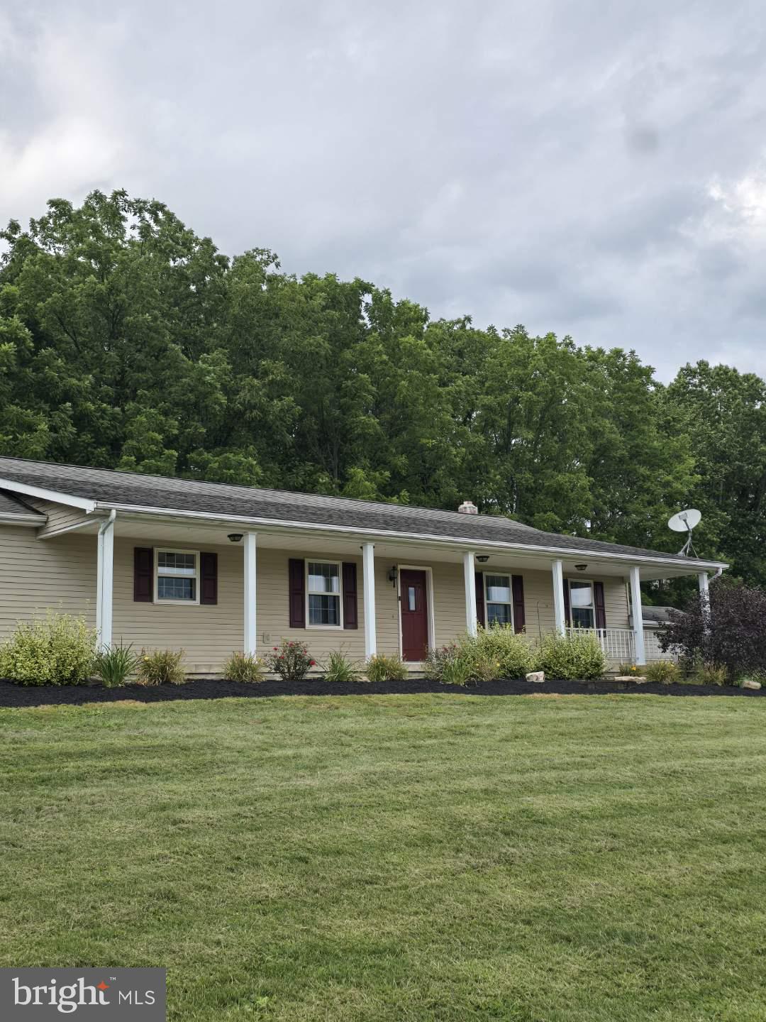 129 Walker Drive Spring Mills, PA 16875 - Photo 2 of 29 a front view of house with yard and green space