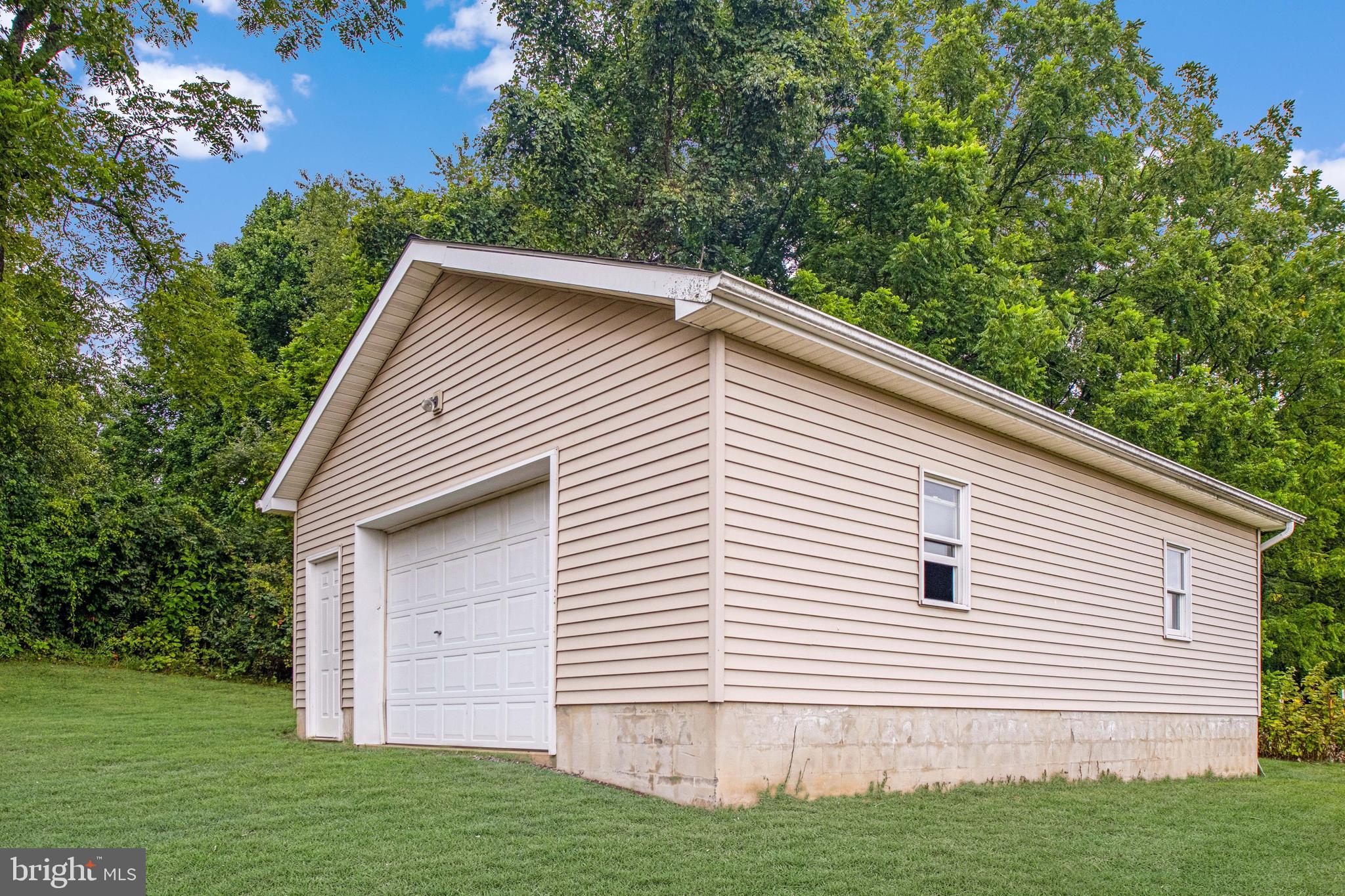 129 Walker Drive Spring Mills, PA 16875 - Photo 25 of 29 a view of a backyard with a garden