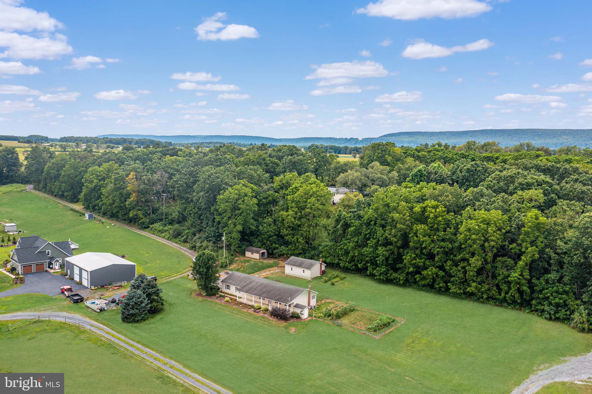 129 Walker Drive Spring Mills, PA 16875 - Photo 27 of 29 a view of a golf course with chairs