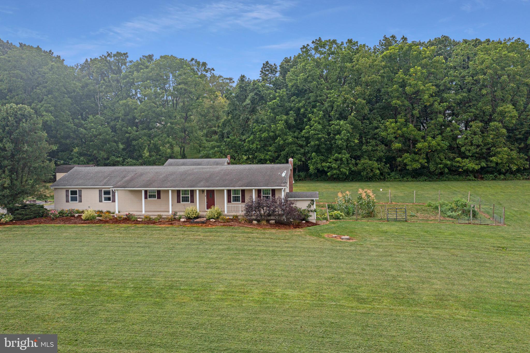 129 Walker Drive Spring Mills, PA 16875 - Photo 29 of 29 a front view of a house with a garden