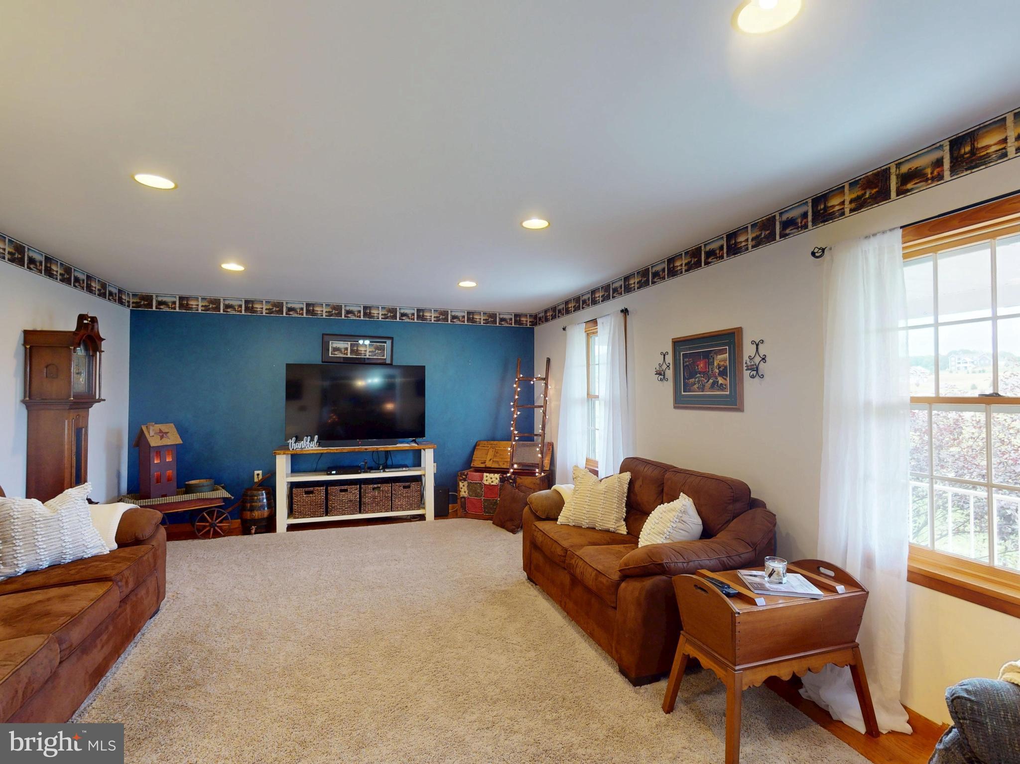 129 Walker Drive Spring Mills, PA 16875 - Photo 5 of 29 a living room with furniture and a flat screen tv