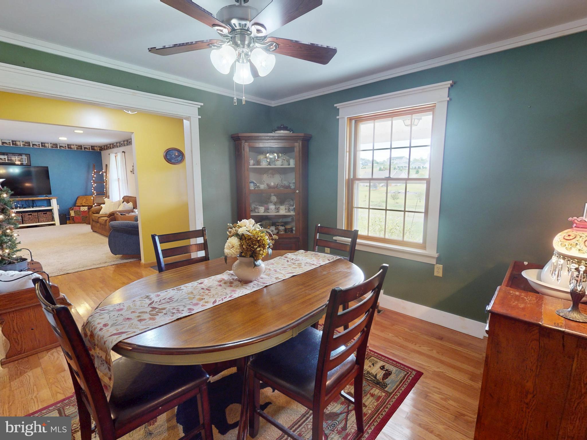 129 Walker Drive Spring Mills, PA 16875 - Photo 7 of 29 a view of a dining room with furniture window and wooden floor