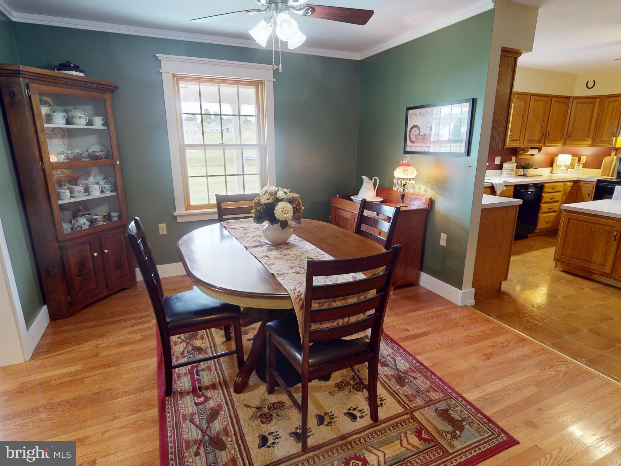 129 Walker Drive Spring Mills, PA 16875 - Photo 8 of 29 a dining room with furniture a chandelier and wooden floor
