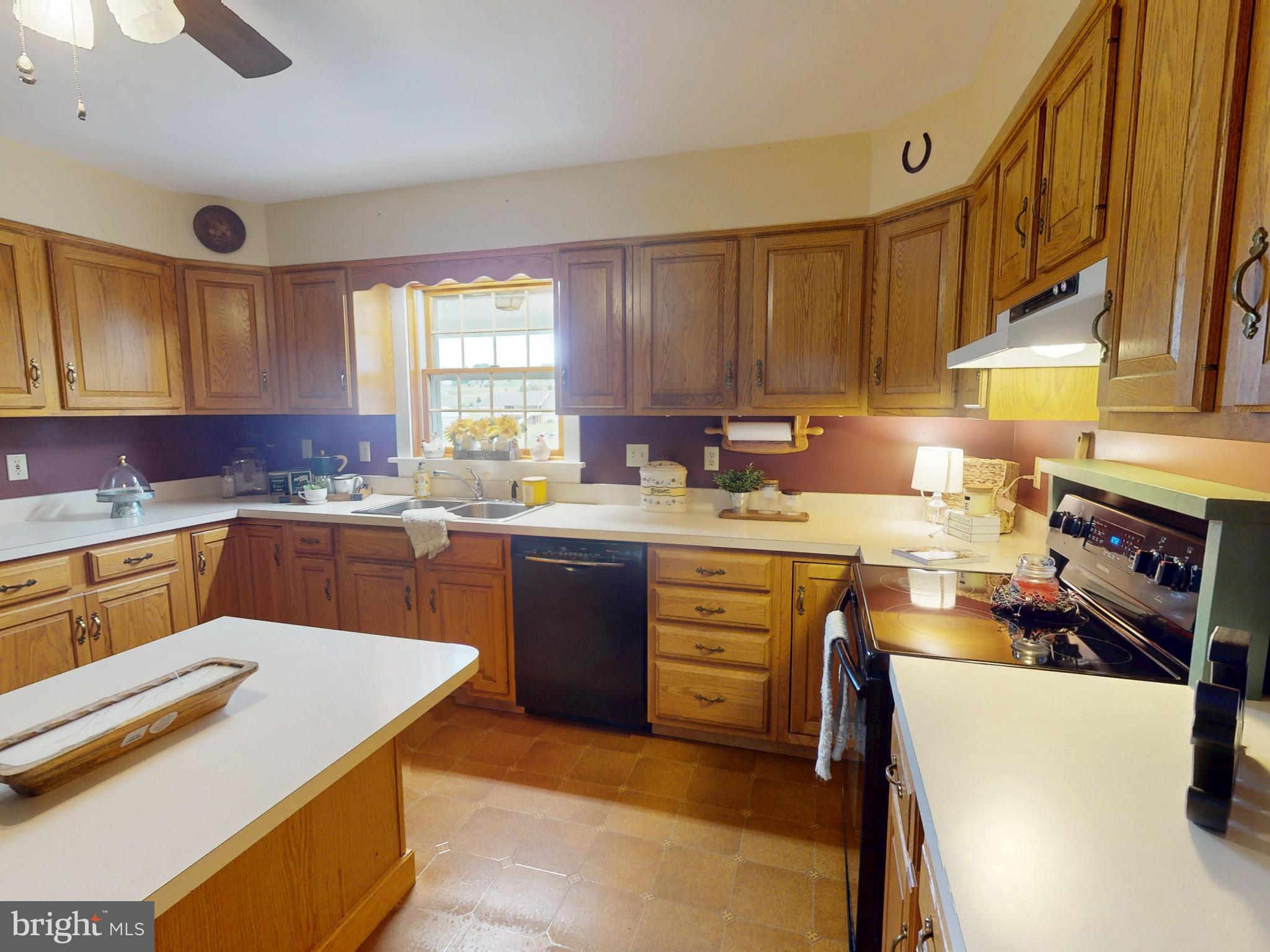 129 Walker Drive Spring Mills, PA 16875 - Photo 10 of 29 a kitchen with a sink stove and cabinets