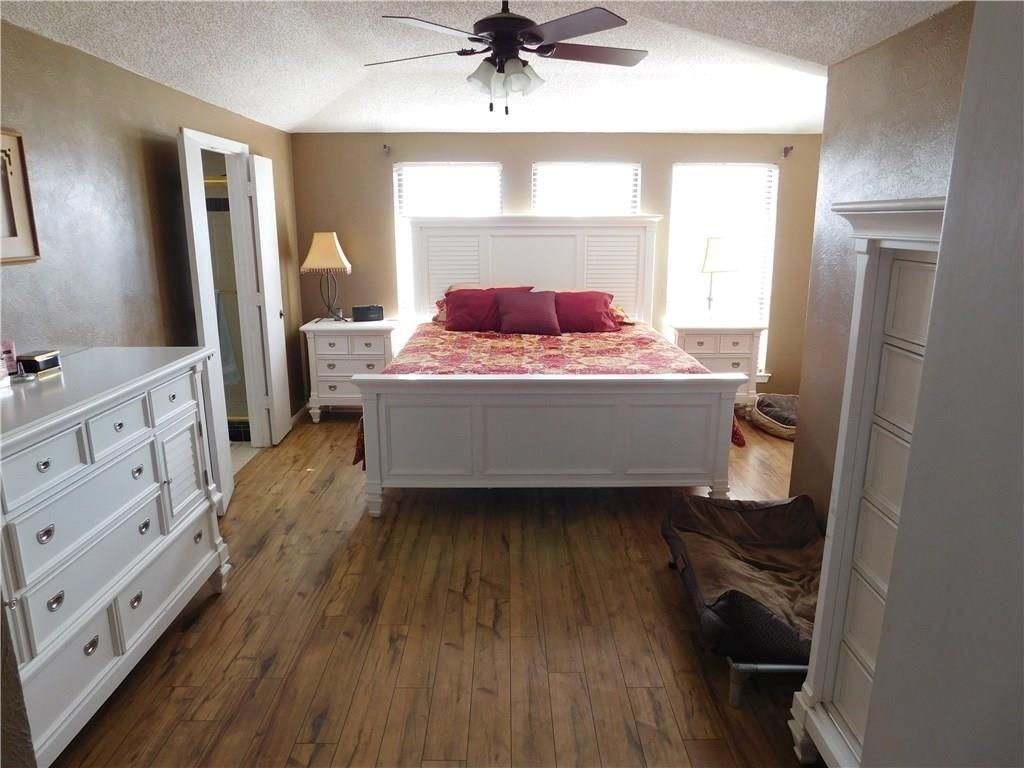 410 Barnes Bridge Road Sunnyvale, TX 75182 - Photo 13 of 20 a living room with a bed and a dresser