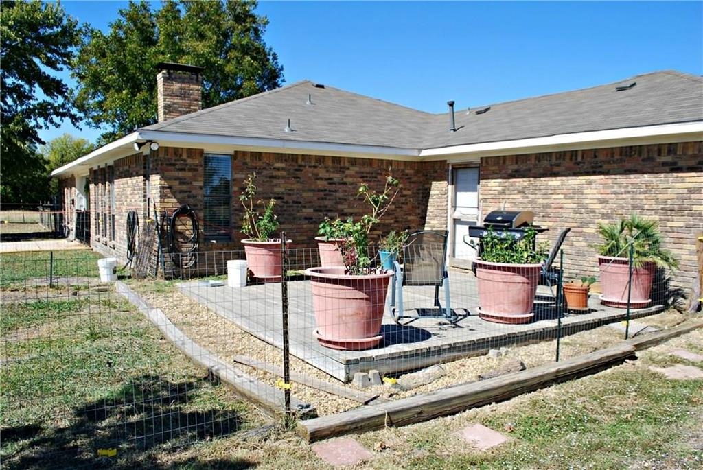 410 Barnes Bridge Road Sunnyvale, TX 75182 - Photo 20 of 20 a view of a patio with chairs and potted plants