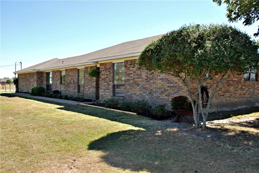 410 Barnes Bridge Road Sunnyvale, TX 75182 - Photo 2 of 20 a view of a house with backyard and trees