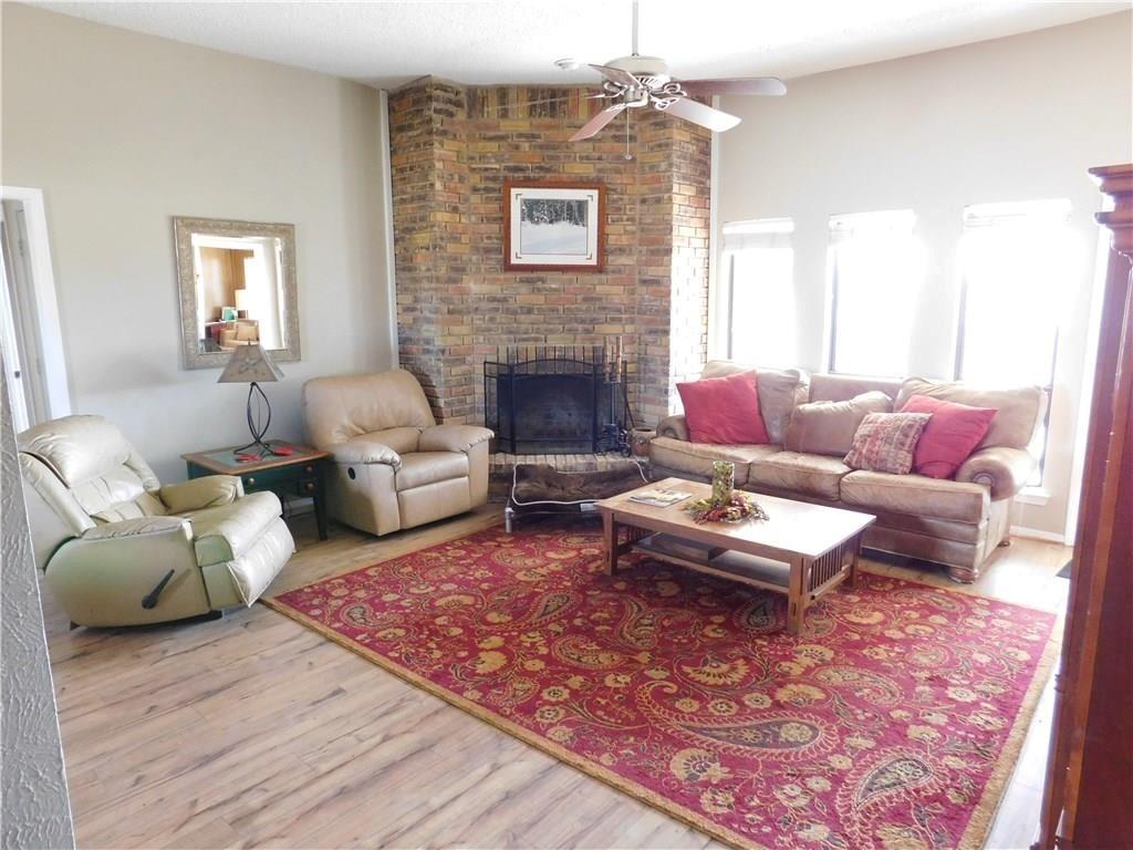 410 Barnes Bridge Road Sunnyvale, TX 75182 - Photo 4 of 20 a living room with furniture and a fireplace