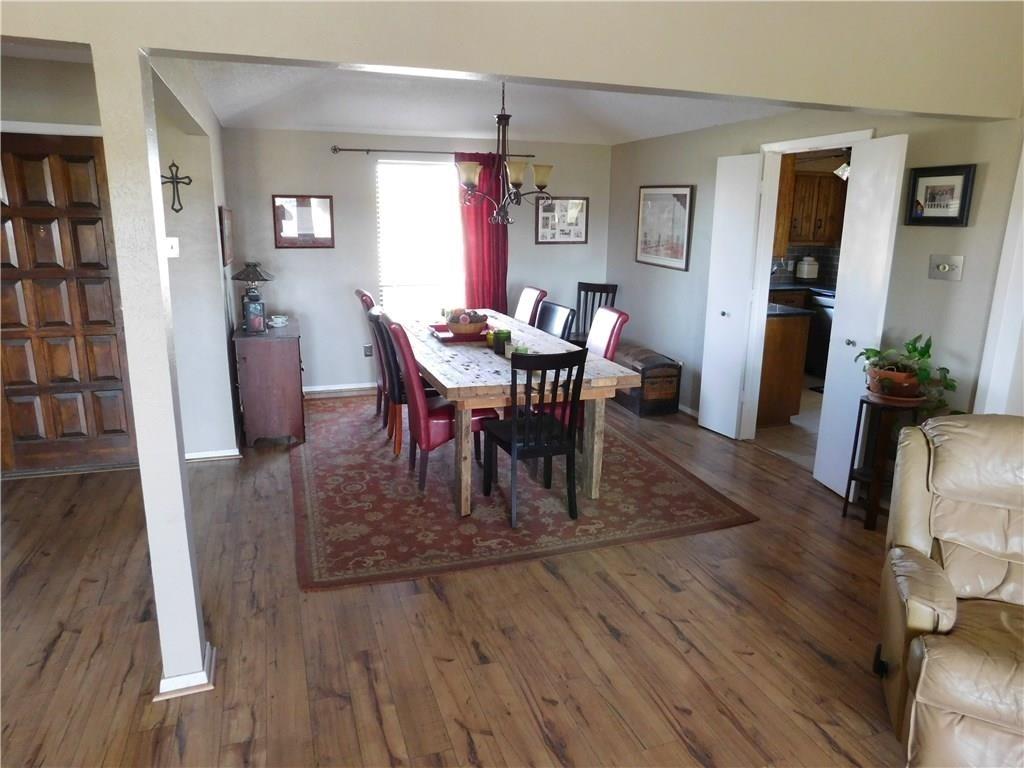 410 Barnes Bridge Road Sunnyvale, TX 75182 - Photo 5 of 20 a view of a dining room with furniture and wooden floor
