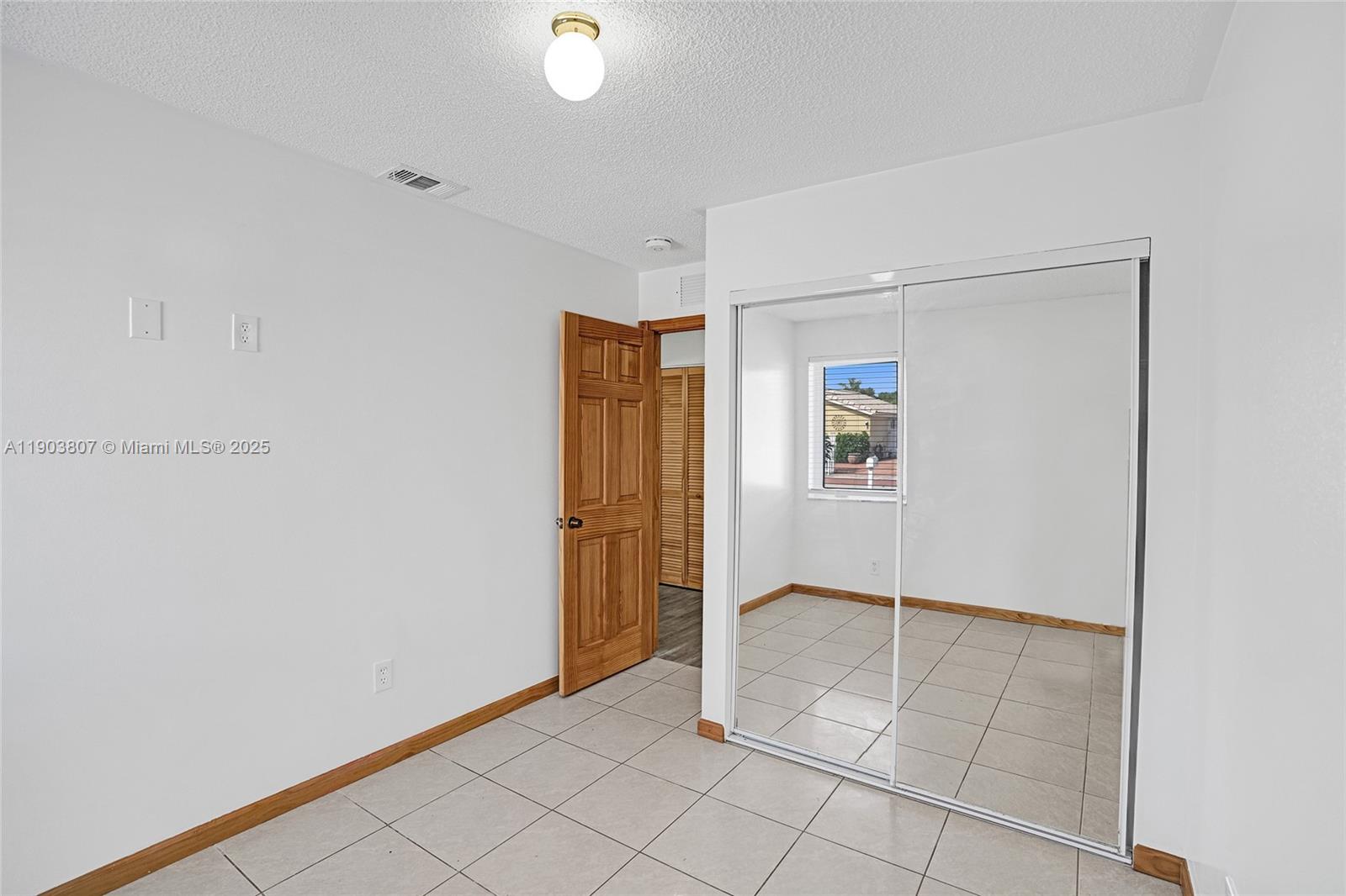 11482 Southwest 181st Street Miami, FL 33157 - Photo 13 of 35 a view of an empty room