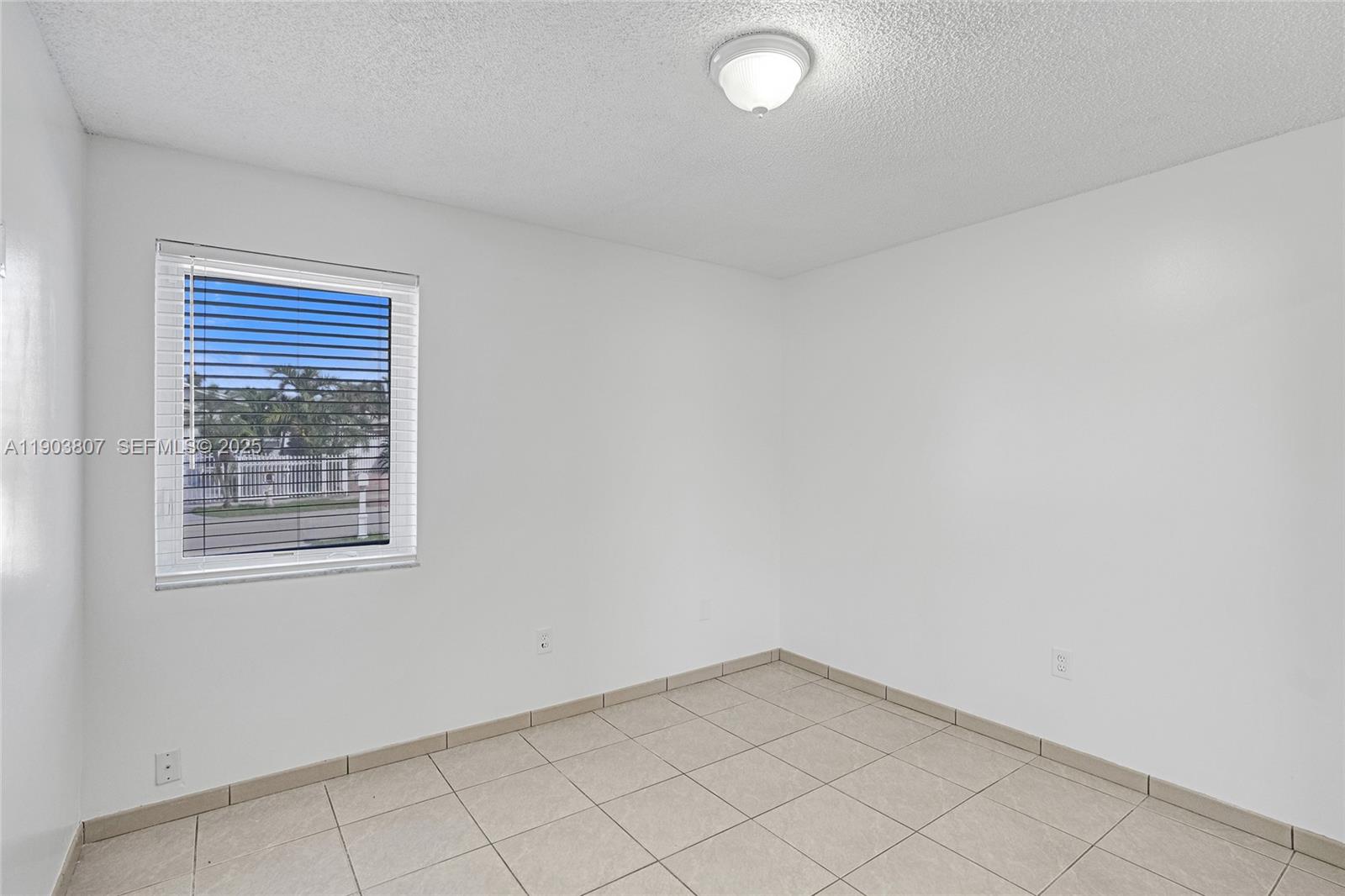 11482 Southwest 181st Street Miami, FL 33157 - Photo 14 of 35 an empty room with a window