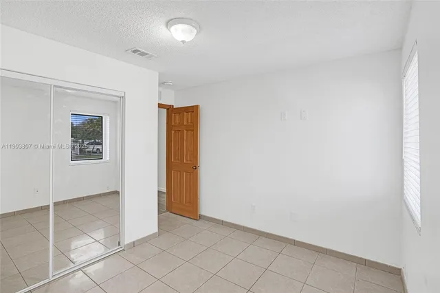 a bathroom with a sink mirror toilet and bathtub