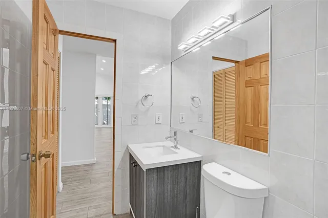 a view of a livingroom with a dishwasher cabinets and wooden floor