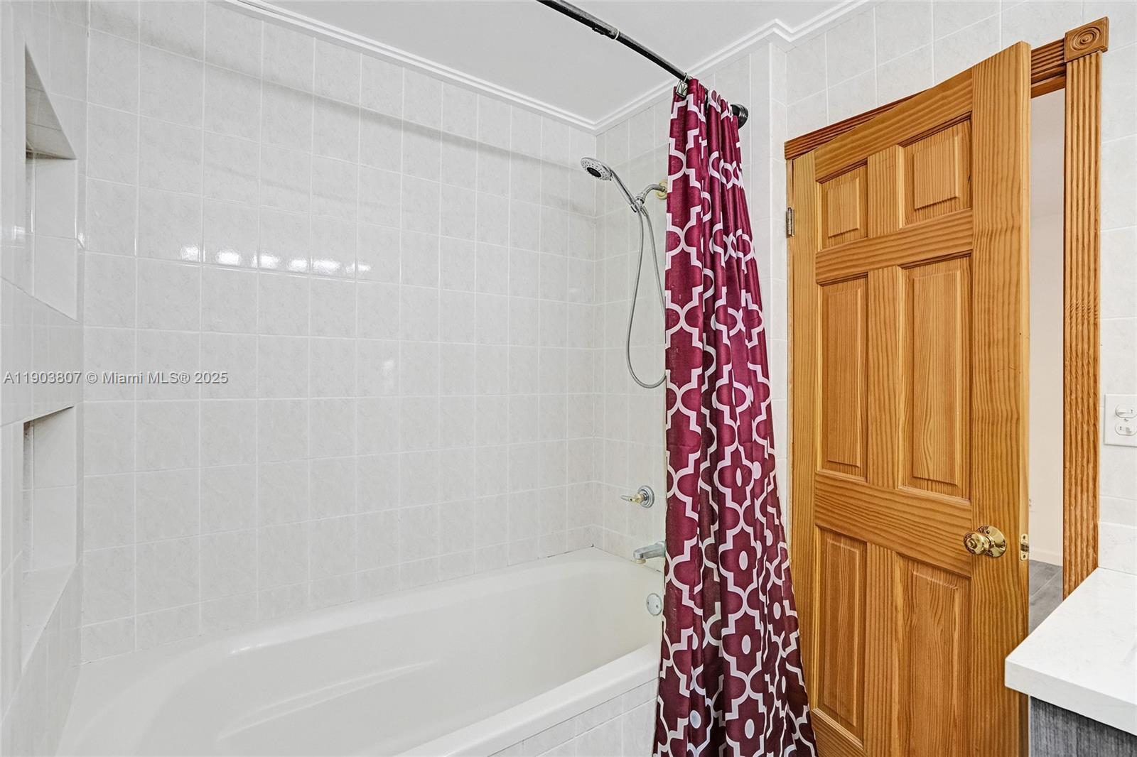 11482 Southwest 181st Street Miami, FL 33157 - Photo 22 of 35 a bathroom with a bathtub and shower