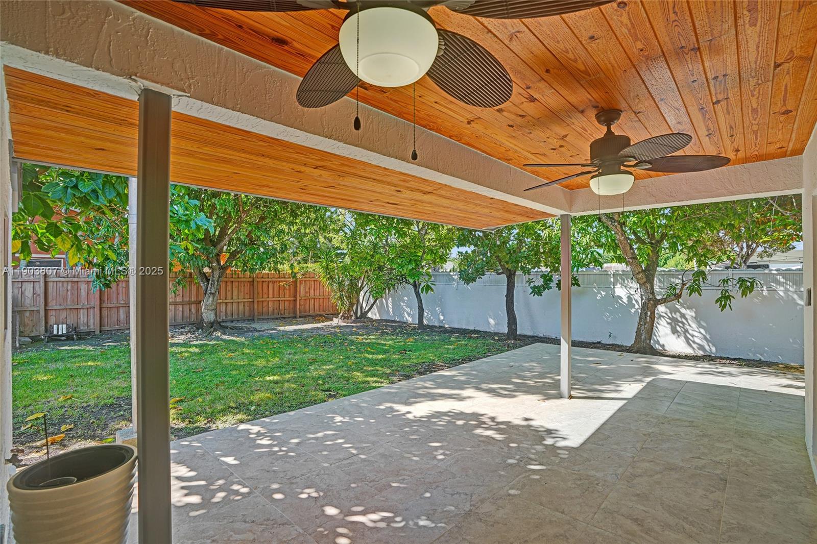 11482 Southwest 181st Street Miami, FL 33157 - Photo 25 of 35 a front view of a house with a yard