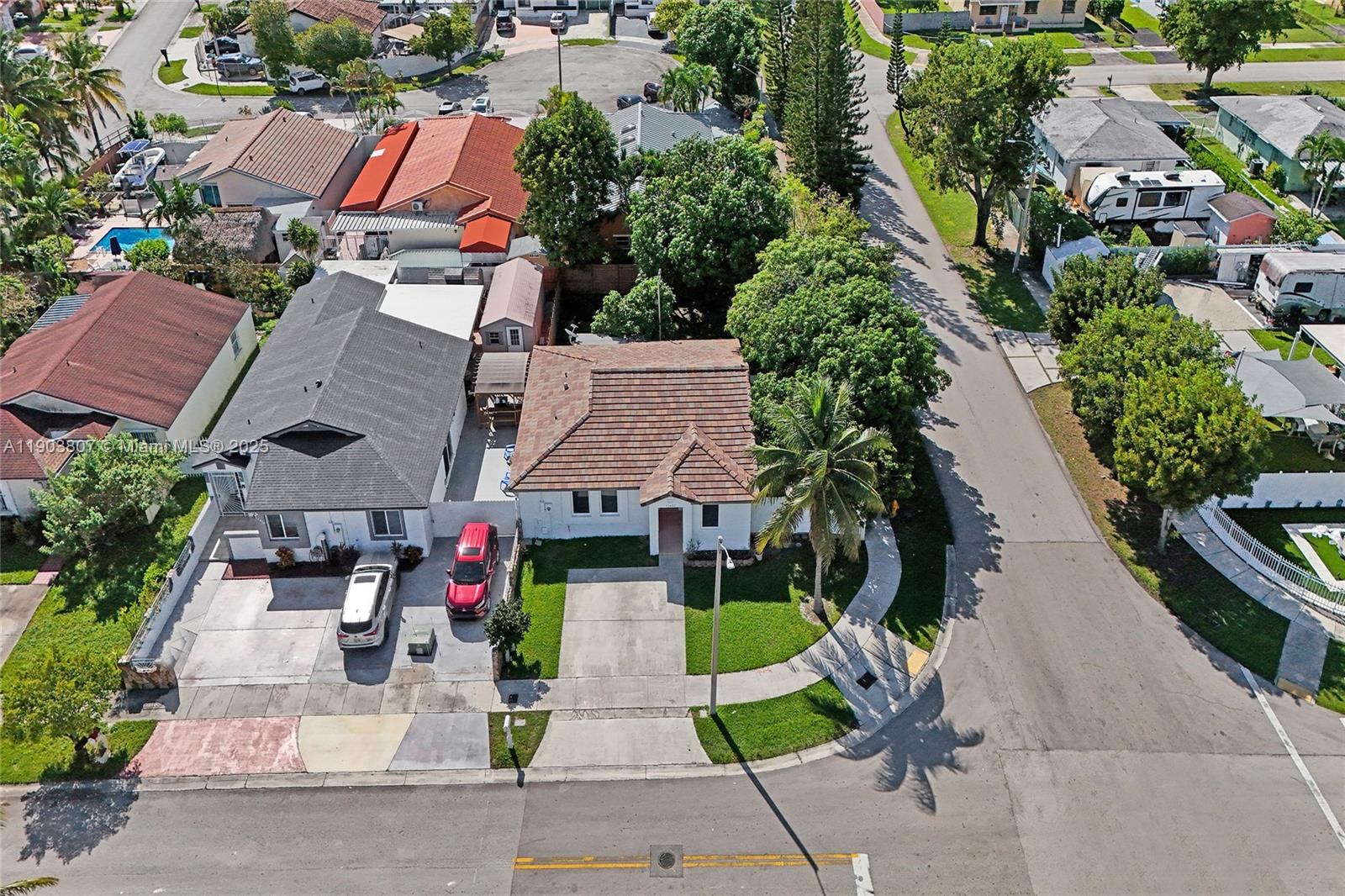 11482 Southwest 181st Street Miami, FL 33157 - Photo 4 of 35 an aerial view of multiple houses with yard