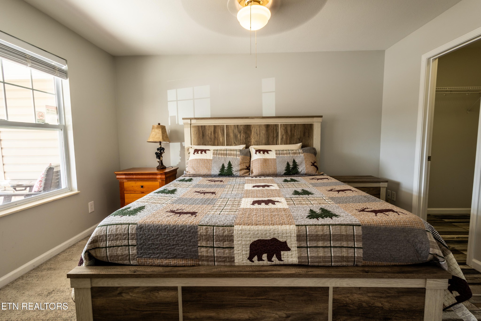 342 Meriwether Way Sevierville, TN 37863 - Photo 4 of 21 a bed sitting in a bedroom next to a window