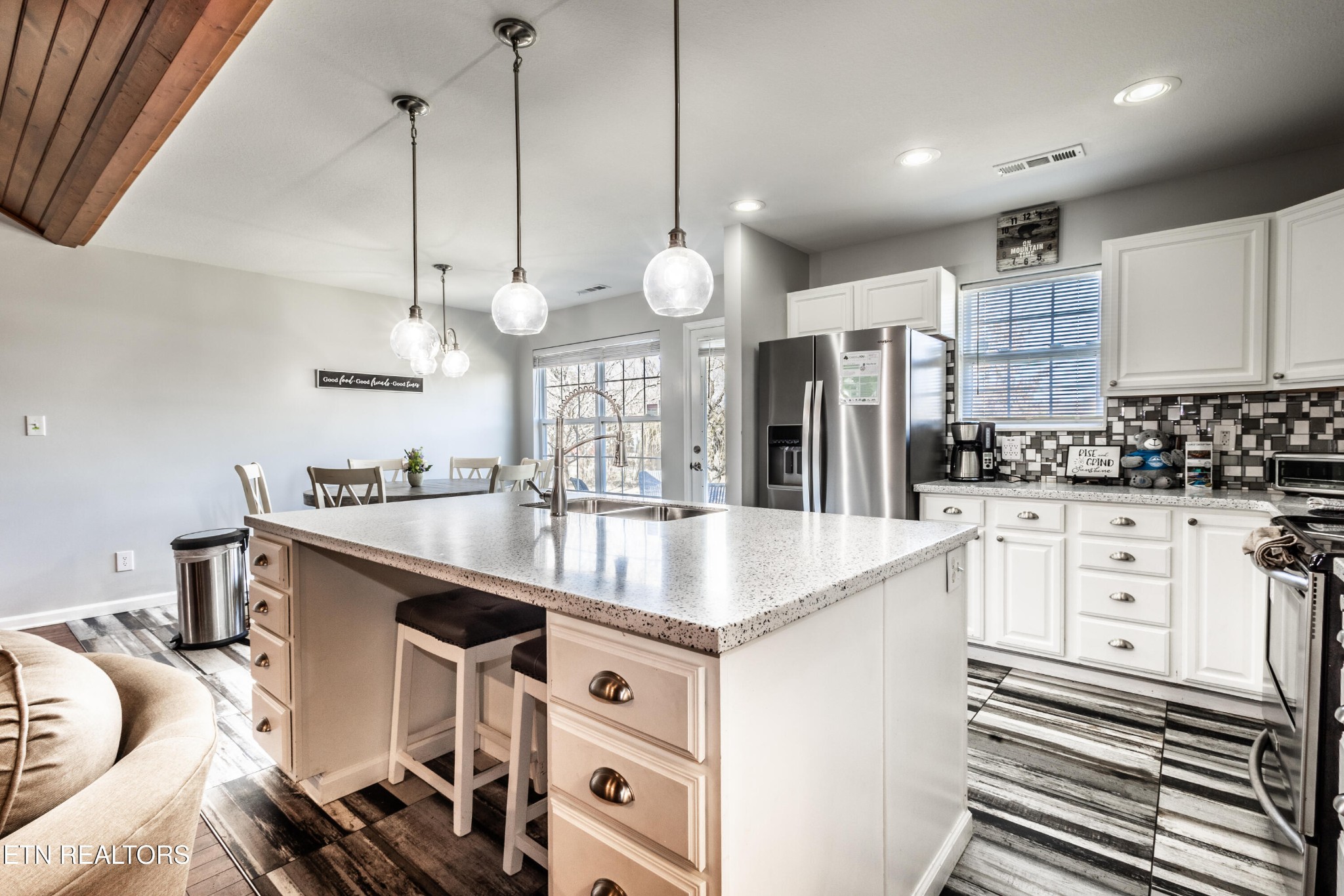 342 Meriwether Way Sevierville, TN 37863 - Photo 8 of 21 a kitchen with stainless steel appliances granite countertop a sink stove and refrigerator