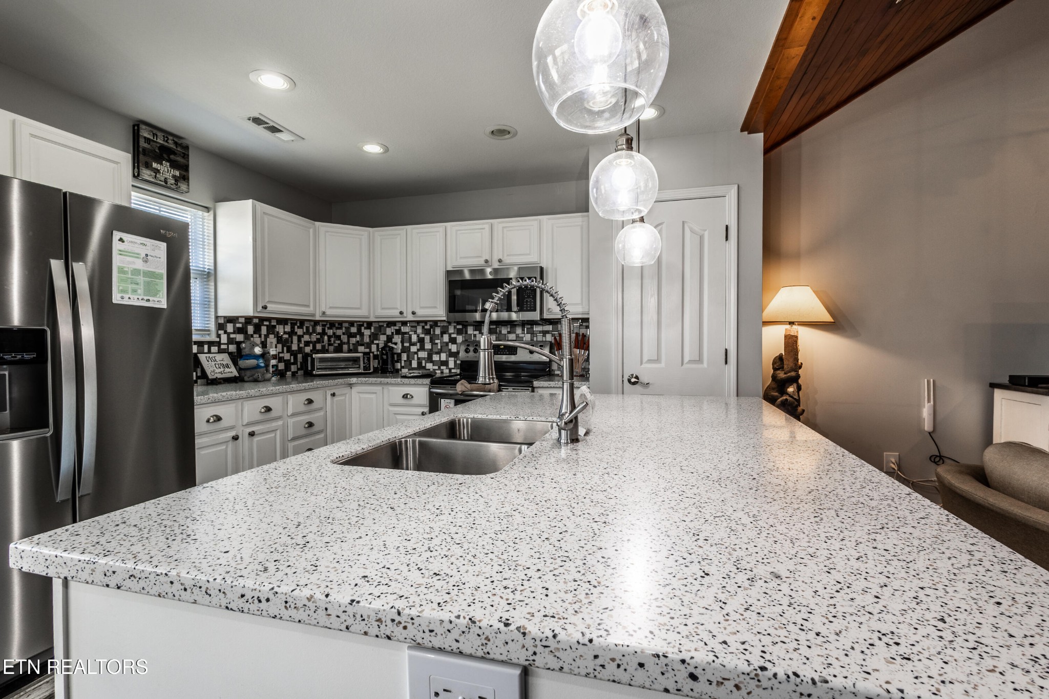 342 Meriwether Way Sevierville, TN 37863 - Photo 9 of 21 a kitchen with stainless steel appliances granite countertop a sink a refrigerator and a granite counter tops