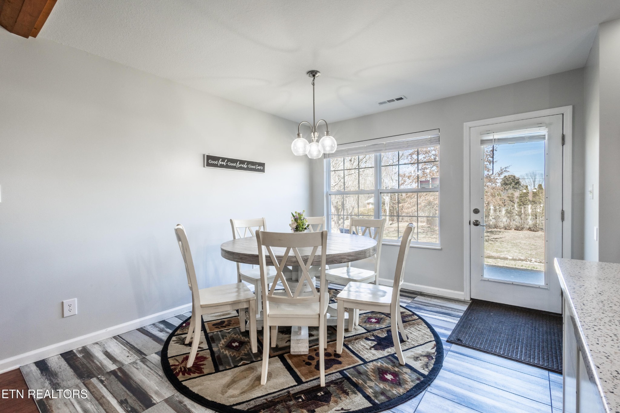 342 Meriwether Way Sevierville, TN 37863 - Photo 10 of 21 a view of a dining room with furniture window and wooden floor